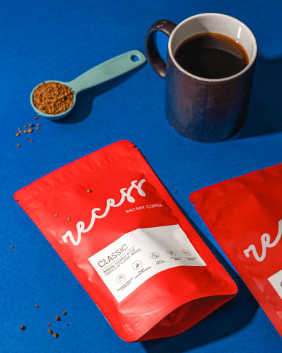 recess coffee pouch with a dark brown coffee in mug